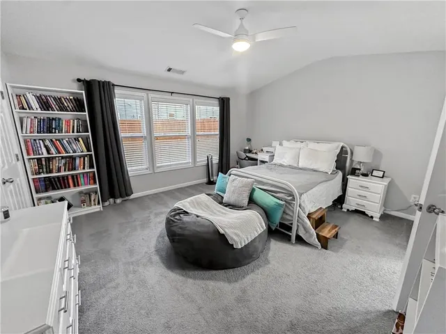 a bathroom with a toilet a sink and a mirror