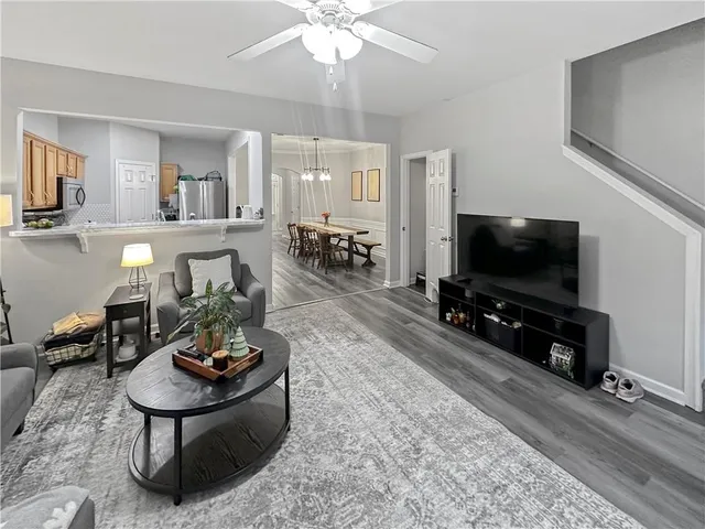 a kitchen with stainless steel appliances granite countertop a stove sink and cabinets