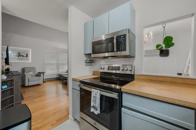 a kitchen with a stove and a microwave