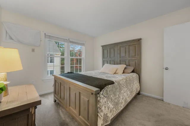 a bedroom with a bed and a table in it