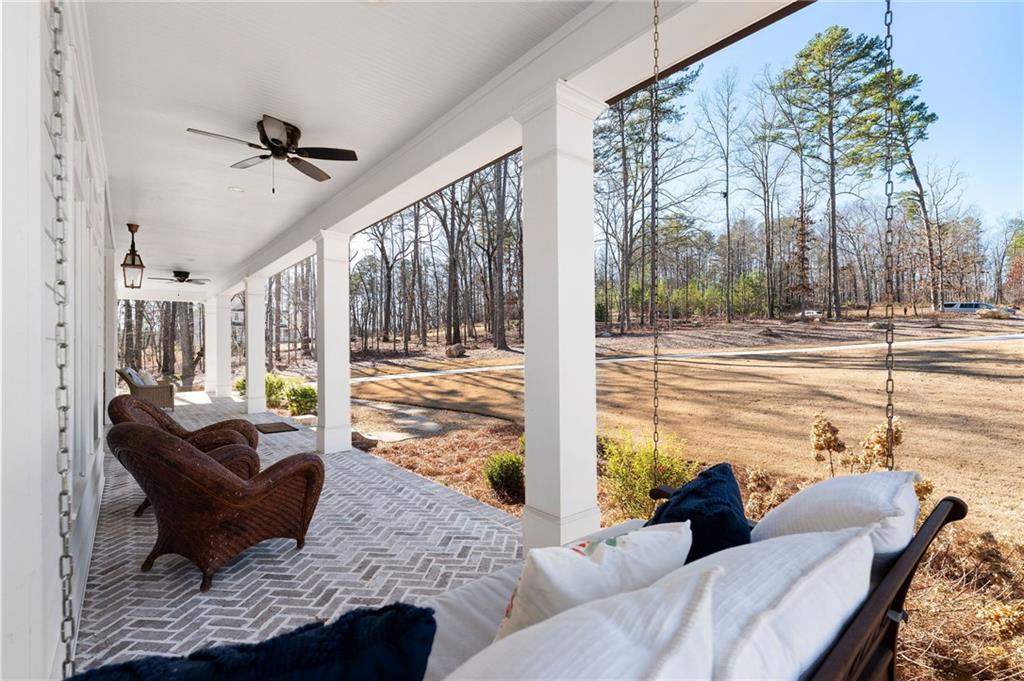 49 Cedar Gate Lane Kingston, GA 30145 - Photo 11 of 73 a living room with furniture and a floor to ceiling window