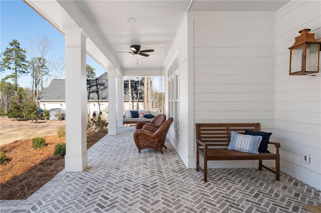 49 Cedar Gate Lane Kingston, GA 30145 - Photo 13 of 73 a outdoor space with patio furniture and a potted plant