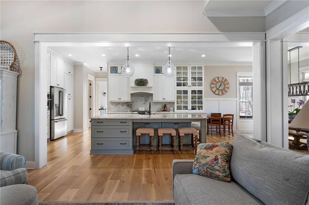 49 Cedar Gate Lane Kingston, GA 30145 - Photo 24 of 73 a large living room with stainless steel appliances kitchen island granite countertop furniture and a large window