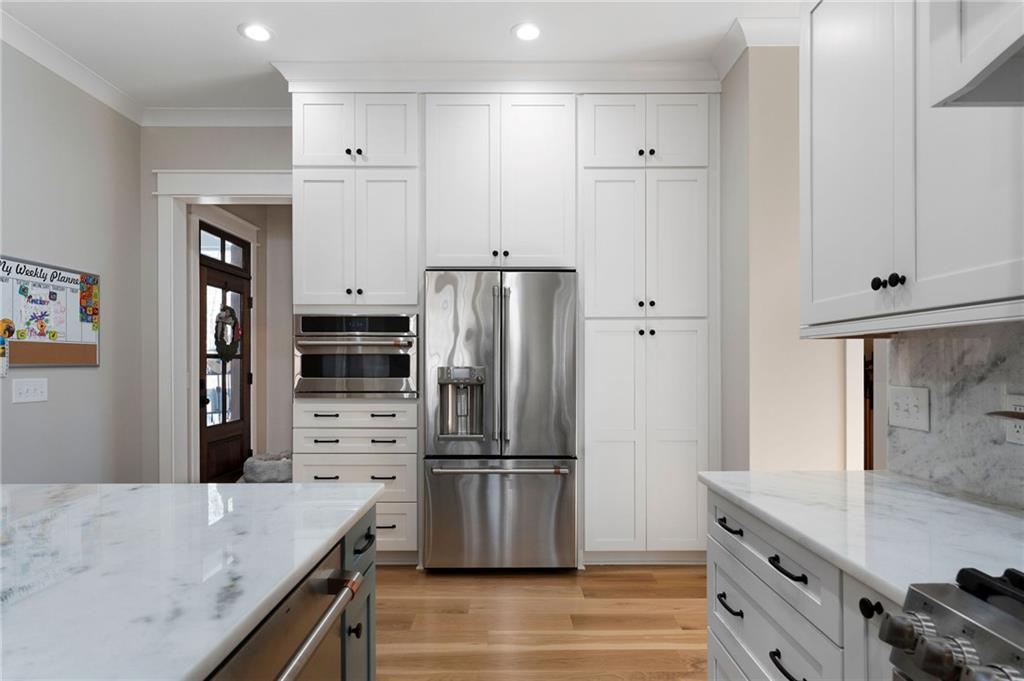 49 Cedar Gate Lane Kingston, GA 30145 - Photo 31 of 73 a kitchen with granite countertop a refrigerator stove and oven