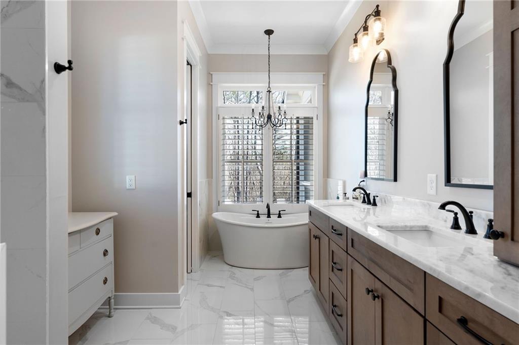 49 Cedar Gate Lane Kingston, GA 30145 - Photo 41 of 73 a spacious bathroom with a double vanity sink mirror and a bathtub