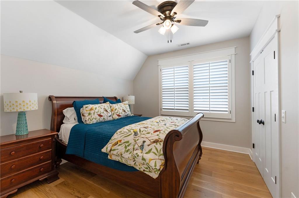 49 Cedar Gate Lane Kingston, GA 30145 - Photo 51 of 73 a bedroom with a bed and a chandelier