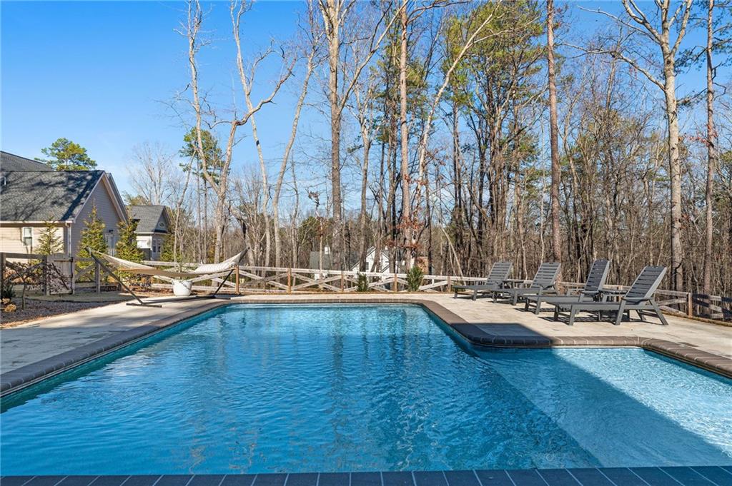 49 Cedar Gate Lane Kingston, GA 30145 - Photo 68 of 73 a view of a swimming pool with chairs