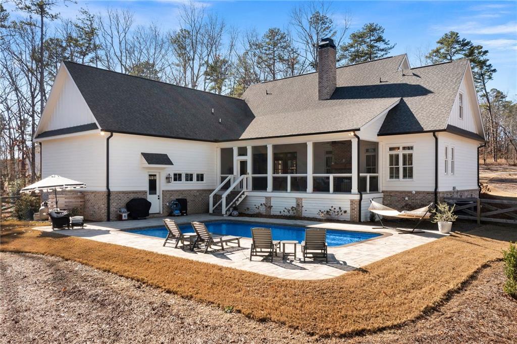 49 Cedar Gate Lane Kingston, GA 30145 - Photo 69 of 73 a view of a house with backyard outdoor seating area and furniture