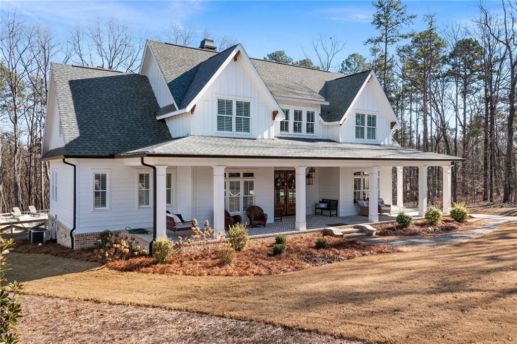 49 Cedar Gate Lane Kingston, GA 30145 - Photo 72 of 73 a front view of a house with a yard outdoor space and seating area