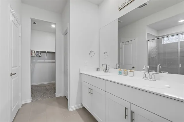 a bathroom with a tub shower and bedroom