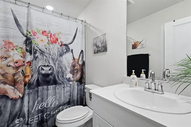 a bathroom with a double vanity sink and mirror