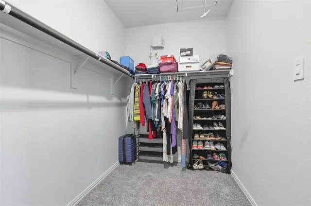 a bathroom with a sink vanity mirror and toilet