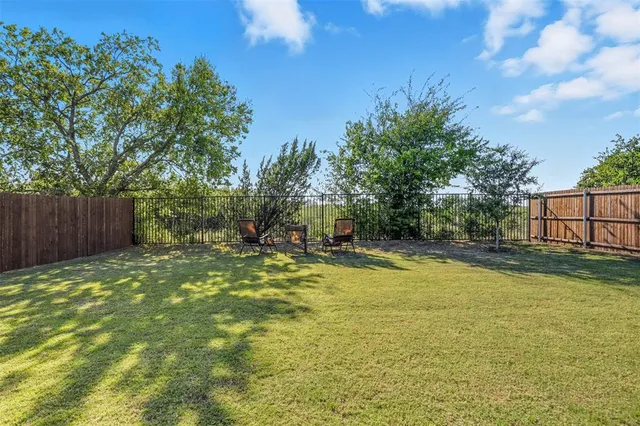 a view of a chairs and tables in the patio