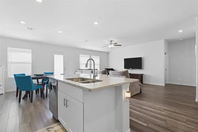 a view of a swimming pool with an outdoor seating and a garden