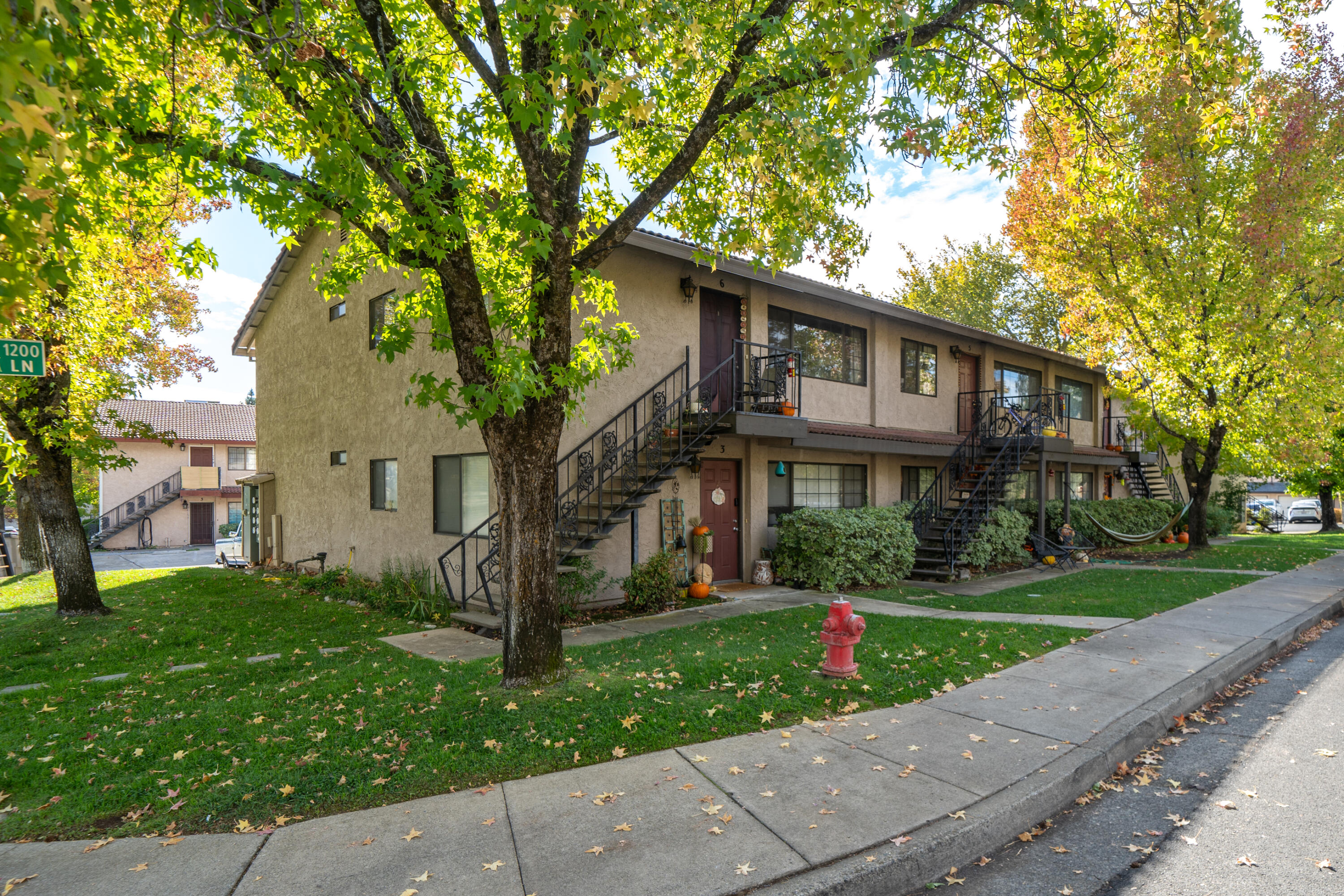 1285 Lancers Lane Redding, CA 96003 - Photo 3 of 15 a front view of a house with a yard
