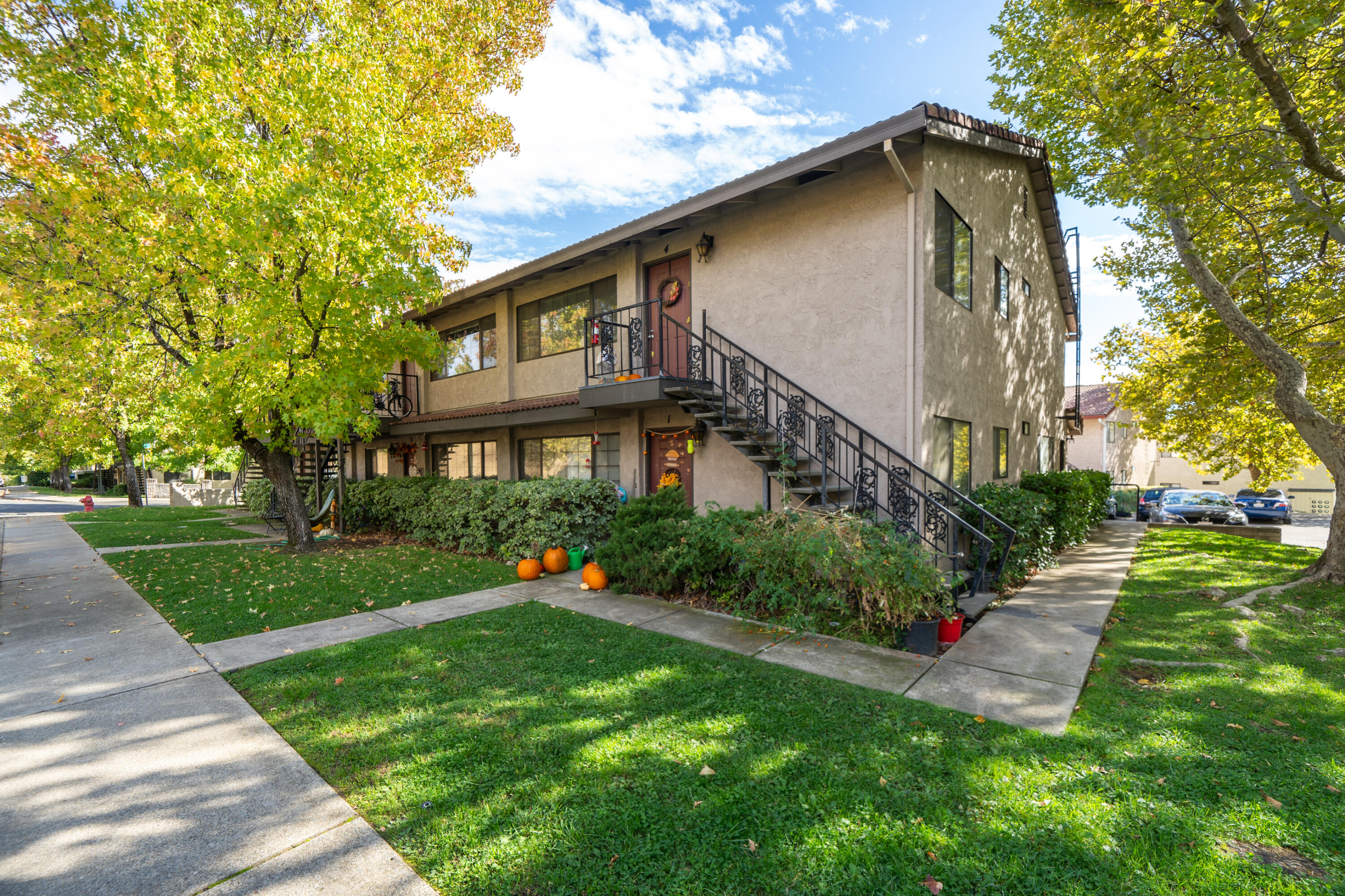 1285 Lancers Lane Redding, CA 96003 - Photo 7 of 15 a front view of a house with a yard and potted plants