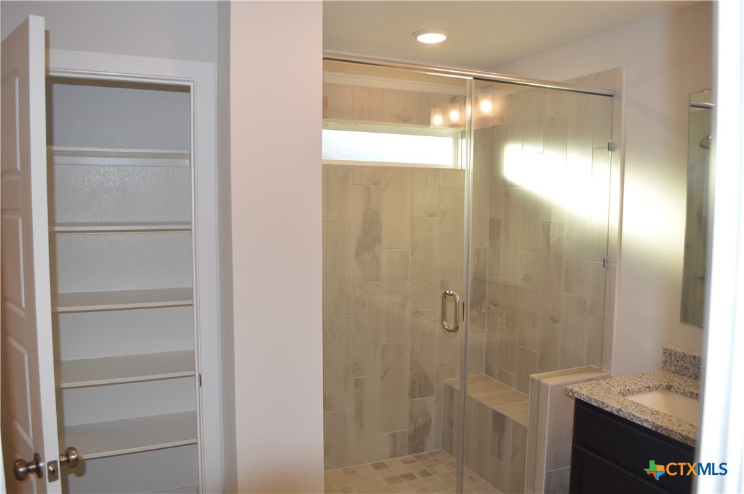 1911 Meridian Loop Temple, TX 76504 - Photo 11 of 26 a bathroom with a shower and a sink