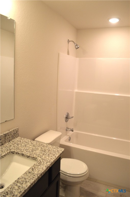 1911 Meridian Loop Temple, TX 76504 - Photo 16 of 26 a bathroom with a granite countertop sink toilet and shower