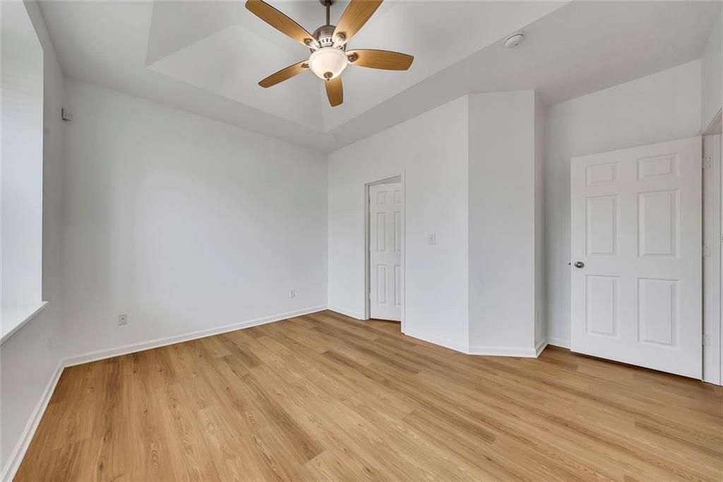 3972 Cutler Donahoe Way Cumming, GA 30040 - Photo 18 of 46 a view of empty room with wooden floor