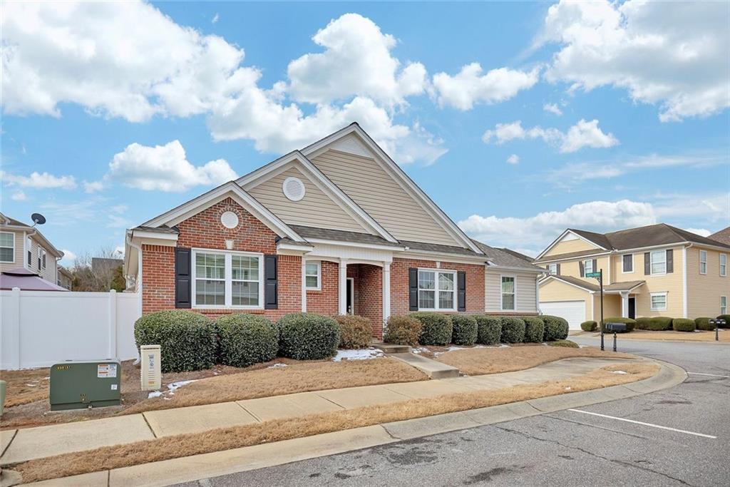 3972 Cutler Donahoe Way Cumming, GA 30040 - Photo 2 of 46 a front view of a house with a yard