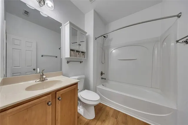a bathroom with a sink a toilet and a bathtub