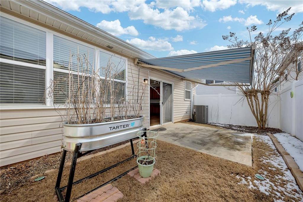 3972 Cutler Donahoe Way Cumming, GA 30040 - Photo 31 of 46 a view of house with backyard and sitting area