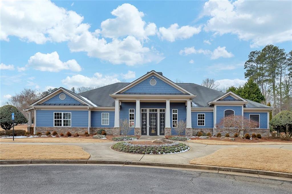 3972 Cutler Donahoe Way Cumming, GA 30040 - Photo 34 of 46 a front view of a house with a garden