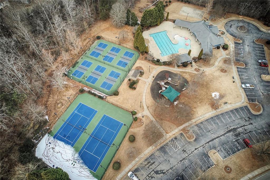 3972 Cutler Donahoe Way Cumming, GA 30040 - Photo 45 of 46 view of living room with a bed and a couch