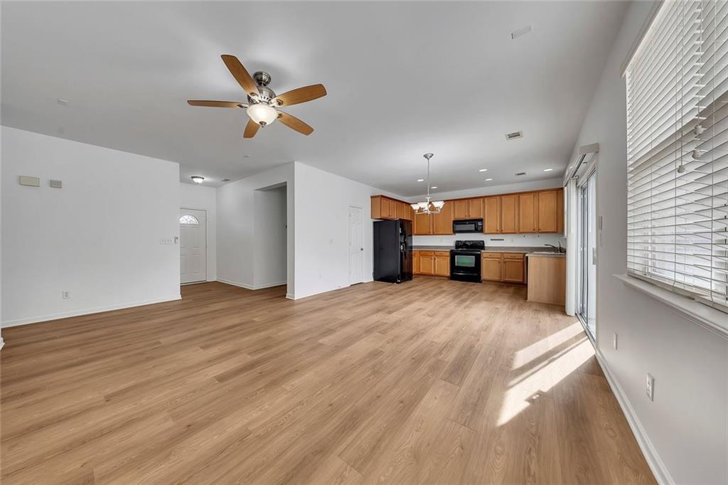 3972 Cutler Donahoe Way Cumming, GA 30040 - Photo 10 of 46 a view of kitchen and wooden floor