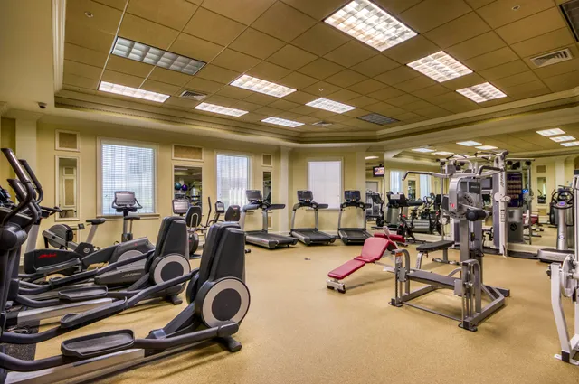 a living room with furniture pool table and a large window