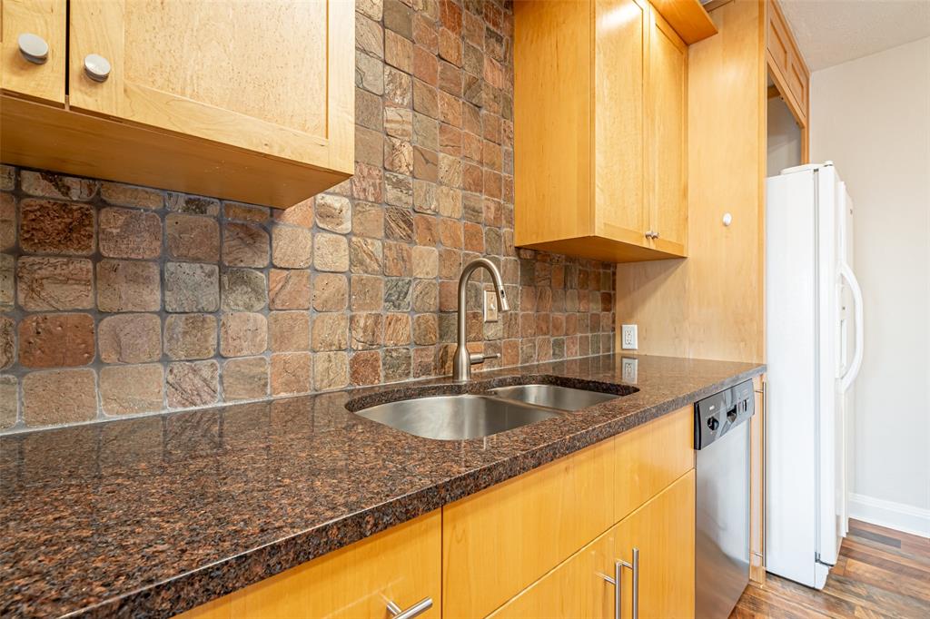9999 Boat Club Road, Unit 207 Fort Worth, TX 76179 - Photo 8 of 32 Kitchen with tasteful backsplash, freestanding refrigerator, stainless steel dishwasher, dark stone countertops, and dark wood-type flooring