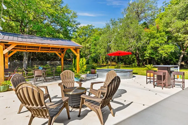 a view of an chairs and tables in the patio