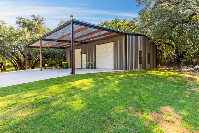 a front view of house with garden