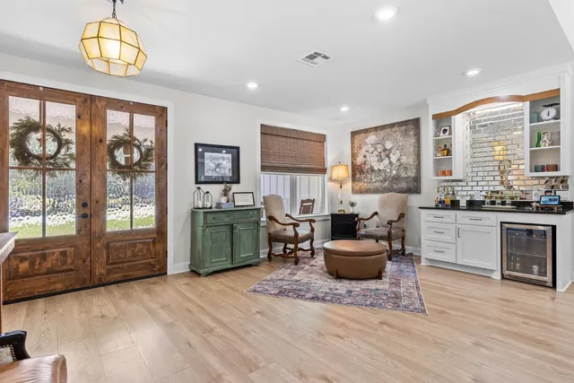 a living room with furniture and a large window