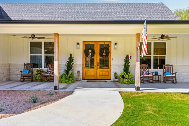 a front view of a house with garden