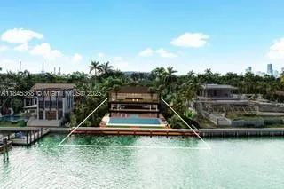 an aerial view of a house with swimming pool and large trees