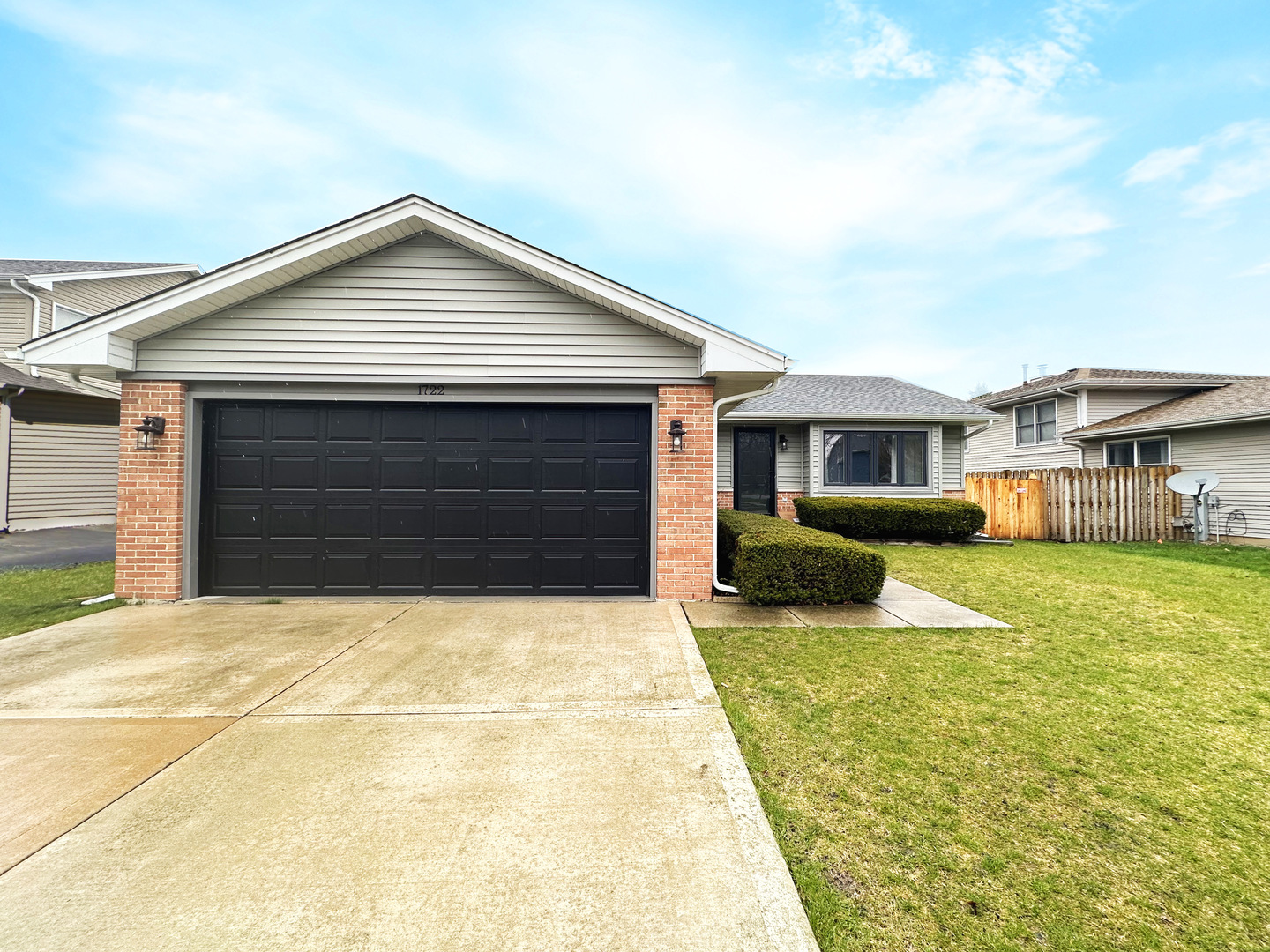 1722 Red Bud Road Bolingbrook, IL 60490 - Photo 1 of 29 a front view of a house with a yard