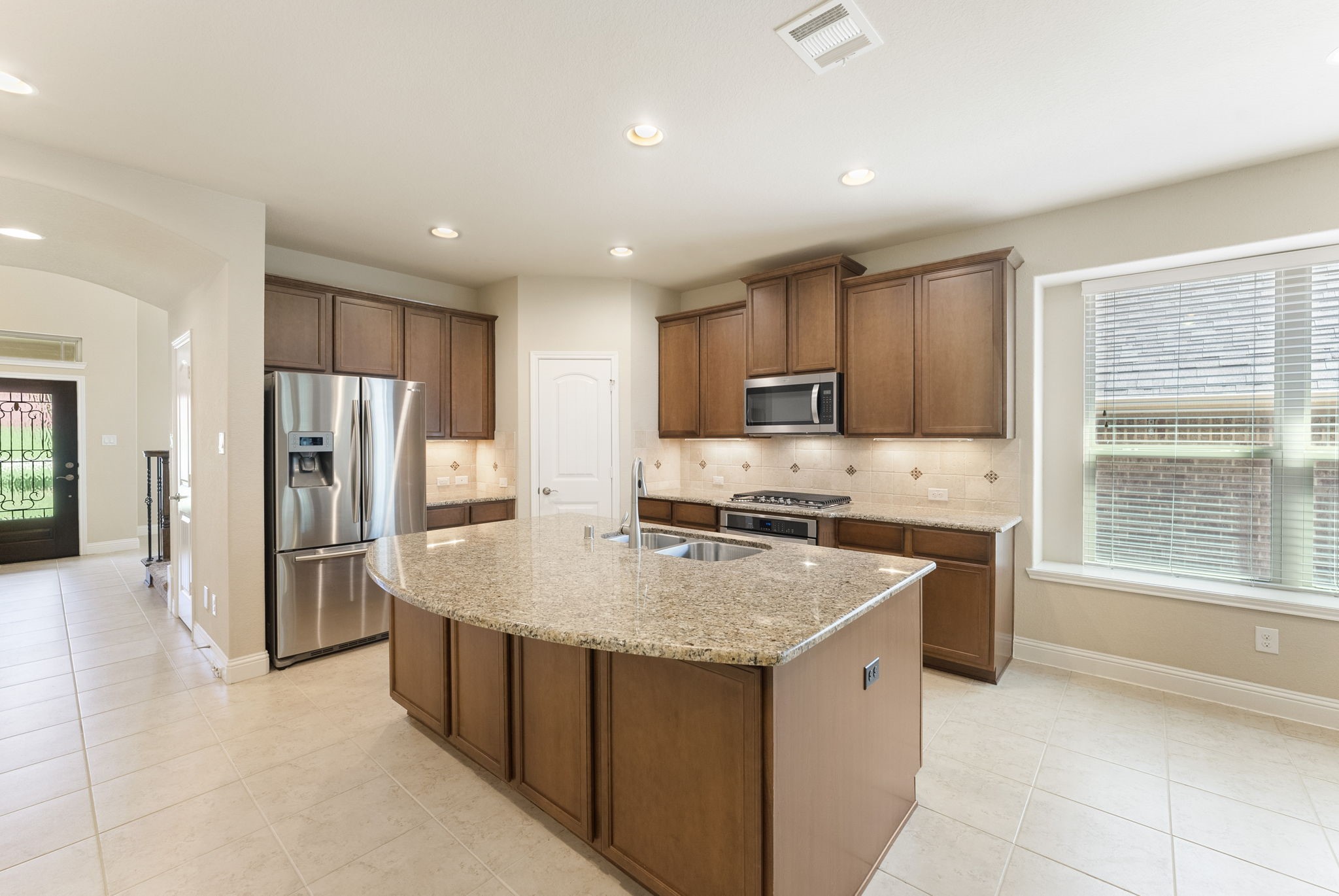 3565 Falcon Way Conroe, TX 77304 - Photo 11 of 50 Spacious kitchen with granite countertops and generous cabinet storage.