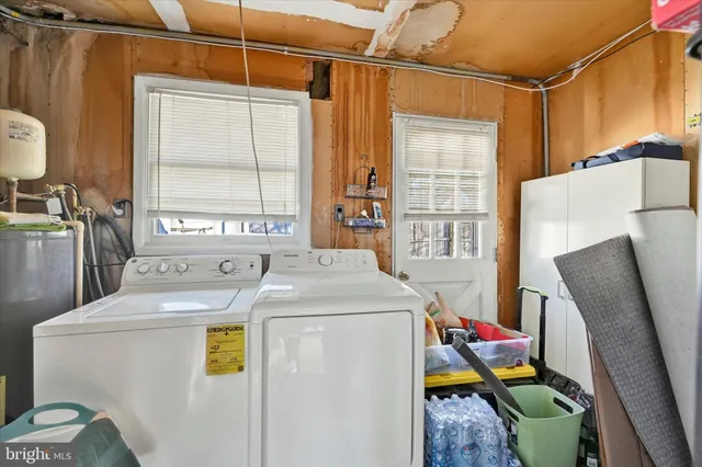 a view of a livingroom with furniture wooden floor and a flat screen tv