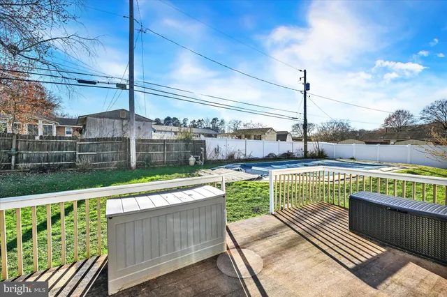 a bathroom with a sink and mirror with toilet