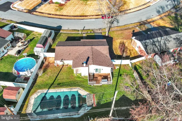 an aerial view of a house with a garden