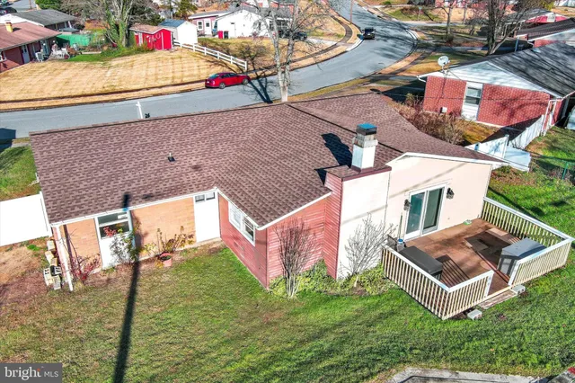 an aerial view of residential houses with outdoor space