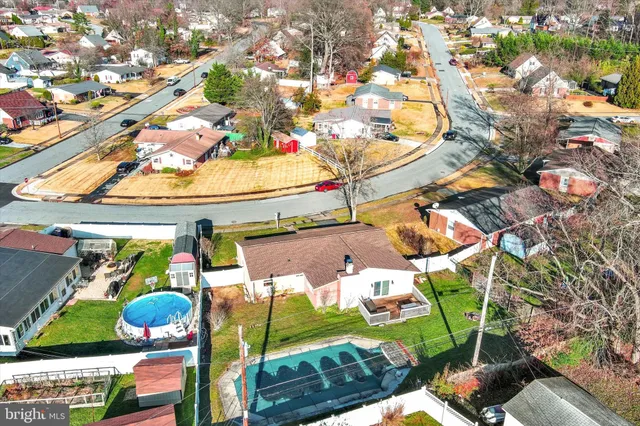 aerial view of a house with a yard