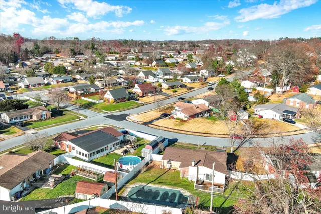 an aerial view of residential houses with outdoor space