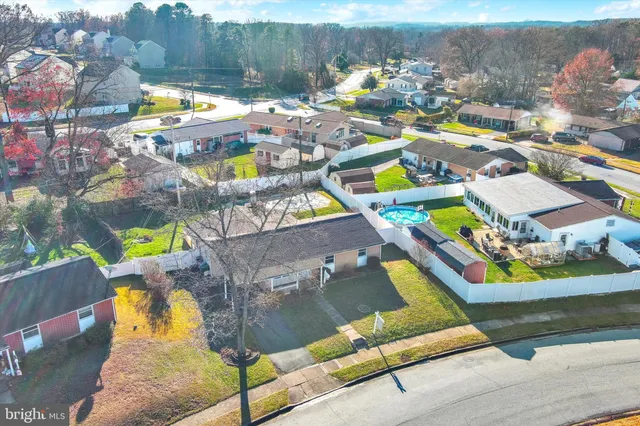 a view of swimming pool with outdoor seating space