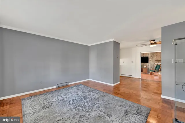 a view of an empty room with glass door
