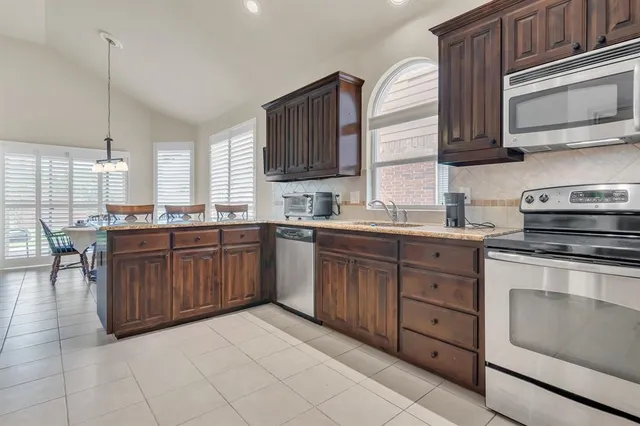 a view of a dining room with furniture and windows