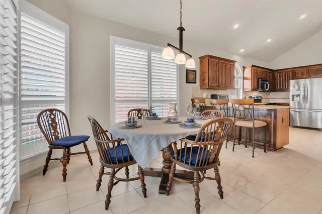 a view of an empty room with wooden cabinet