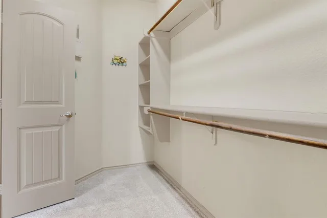 an empty room with a empty space and chandelier fan