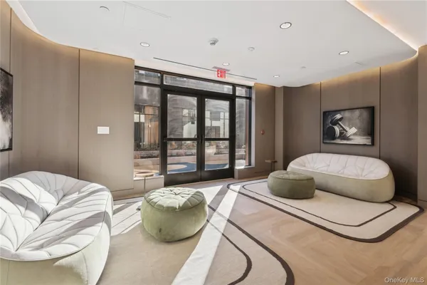 a living room with furniture and fireplace